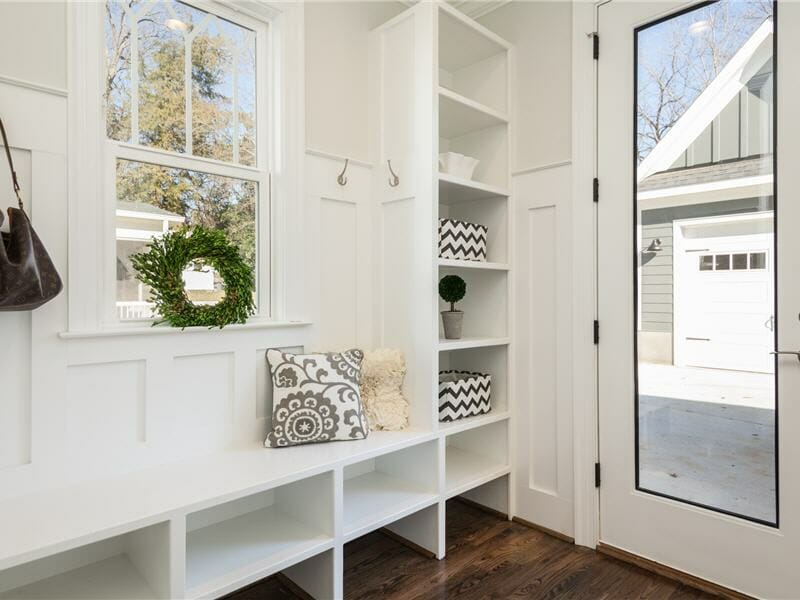 White entrance hall with dark wood floor